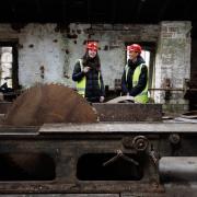 Restoration of the stables and sawmill in Pollok Country Park. Pictured are Alex Fleming-Knox (programme officer with Glasgow City Council), left and colleague Jane Slater, right, (assistant programme officer with GCC) in the saw mill. The A-Listed