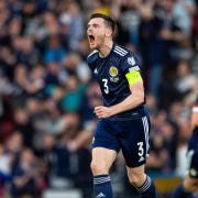 Andy Robertson says that the Scotland players are thriving by playing in front of full houses at Hampden.