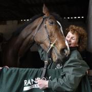Grand National winner One For Arthur pictured with trainer Lucinda Russell at her yard in Kinross