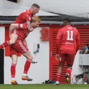 Aberdeen's Liam Scales celebrates his team's first goal with Jonny Hayes during the cinch Premiership match
