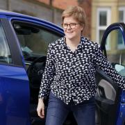 Nicola Sturgeon getting out of a car after a driving lesson