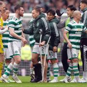 Celtic right back Alistair Johnston, centre, on crutches at the end of the Scottish Cup semi-final win over Rangers at Hampden