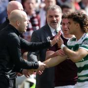 Hearts manager Steven Naismith, left, exchanges words with Celtic winger Jota, right, at Tynecastle today as Ange Postecoglou looks on