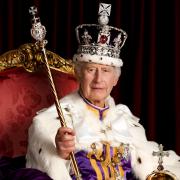 King Charles III is pictured in full regalia in the Throne Room at Buckingham Palace, London