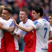 James Tavernier, second right, is congratulated by his Rangers team mates after opening the scoring against Hibernian at Easter Road today