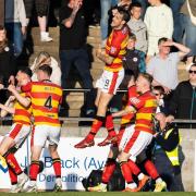 Partick Thistle's players celebrate Jack McMillan's opener in their romp over Ayr United.