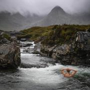 A swimmer in the Fairy Pools