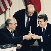 Michael Gorbachev and Ronald Reagan sign the Intermediate Range Nuclear Forces Treaty, which took effect in June 1988. The two superpowers later negotiated the Strategic Arms Reduction Treaty.