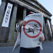 Fans desperate to get Herald souvenir Banksy front page