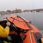 Boy rescued by lifeboat after falling from rocks at Scots harbour
