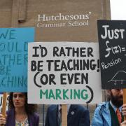 Teaching staff at Hutcheson's Grammar School are taking industrial action over reduced pensions. Pictured are EIS members on a picket outside the school