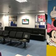 Murals of cartoon characters including Mickey Mouse and Baloo from The Jungle Book painted on the walls of an asylum seeker reception centre in Dover