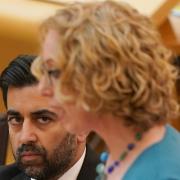 First Minister and SNP leader Humza Yousaf watches circular economy minister Lorna Slater of the Scottish Greens make a statement to MSPs