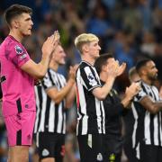 Newcastle players clap their fans at the Etihad