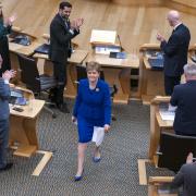Nicola Sturgeon leaving the Holyrood chamber after her last speech on March 23