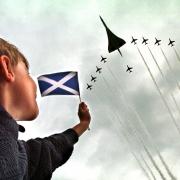 A boy watches a fly-past of the Red Arrows and Concorde at the opening of the Scottish Paliament in 1997. There was a real air of optimism then, but recent years have seen a series of conflicts with Westminster