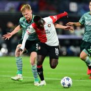Celtic defender Liam Scales, left, tries to tackle Feyenoord forward Yankuba Minteh in a Champions League match in Rotterdam on Tuesday night