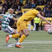 Celtic attacker Daizen Maeda curls a beautiful finish past Shamal George to seal the win at Livingston.