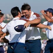 Europe’s Viktor Hovland, left and Europe’s Ludvig Aberg hug on the 11th green after defeating the United States pair of Scottie Scheffler and Brooks Koepka (Gregorio Borgia/AP)