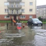 This resident of Barmulloch, Glasgow, resorted to using a kayak to access his road owing to the weekend flooding