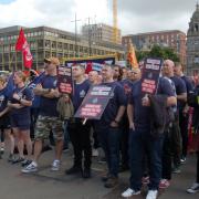 Members of the Fire Brigades Union (FBU) across Scotland gather for a rally at George Square in Glasgow