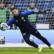 Motherwell goalkeeper Liam Kelly got his first cap for Scotland against France on Tuesday night.