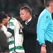 Brendan Rodgers, centre, comforts Celtic midfielder Reo Hatate as he goes off against Atletico Madrid at Parkhead