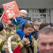 Firefighters from the Fire Brigades Union (FBU) take part in the Cuts Leave Scars rally outside the Scottish Parliament in Edinburgh