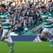 Celtic playmaker Matt O'Riley, right, runs in to congratulate Yang Hyun-jun on his goal against Aberdeen at Parkhead on Sunday