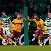 Motherwell striker Jon Obika wheels away after his late goal against Celtic.