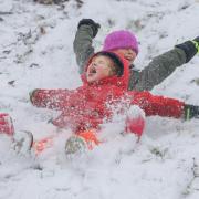 Children enjoy the snow in Glasgow's Kelvingrove Park
