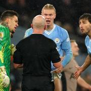Manchester City’s Erling Haaland, goalkeeper Ederson (left) and Ruben Dias (right) react to referee Simon Hooper (centre) (Martin Rickett/PA)