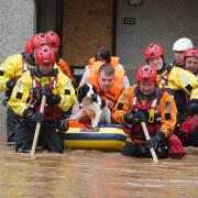 Members of the emergency sevices helping a man to safety  when Storm Babet hit Brechin in October.