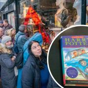 Customers queue outside the Shelter Scotland charity shop in Edinburgh's Stockbridge for the opening of the annual January sale