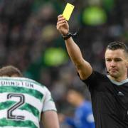 Referee Nick Walsh shows Celtic right back Alistair Johnston a yellow card during the cinch Premiership game against Rangers at Parkhead last week