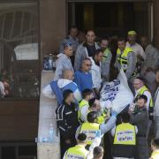 Israeli rescue workers carry a body from a synagogue in Jerusalem after a 2014 attack in which two Palestinians armed with knives, axes and guns had killed four worshippers