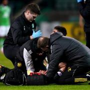 Celtic full back Alistair Johnston is waiting for scan results on a fracture to his head.