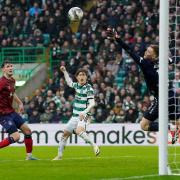 Celtic striker Kyogo Furuhashi watches as his header beats Kilmarnock keeper Will Dennis to open the scoring at Celtic Park.