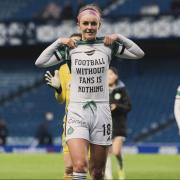 Caitlin Hayes displays a message of protest on her T-shirt
