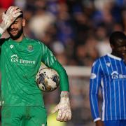 St Johnstone keeper Dimitar Mitov holds his head after a Rangers goal at McDiarmid Park on Sunday