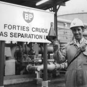 Bob McLean at BP Grangemouth with first sample of Forties Field North Sea oil, on November 3, 1975