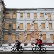 Viktoria* (L) and Oleh (R) cycle in winter conditions through Kharkiv, Ukraine on 18 November 2022
