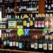 MSPs on a Holyrood committee have been urged to increase the minimum unit price (MUP) on alcohol to 65p.