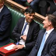 Prime Minister Rishi Sunak and Chancellor Jeremy Hunt share pleasantries in the Commons on Wednesday