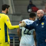 Scotland manager Steve Clarke, right, shakes hands with Craig Gordon after a game