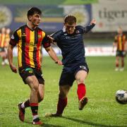 Partick Thistle's Lewis Neilson and Raith Rovers' Jack Hamilton in action