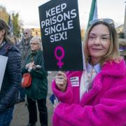 Members of campaign group, Women Won't Wheesht, protest outside Scottish Government building