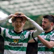 Kyogo Furuhashi, left, celebrates scoring against St Johnstone at Parkhead today with his team mate Greg Taylor