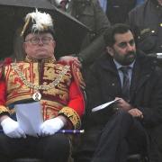 Humza Yousaf watches a Beating Retreat ceremony for the Stone of Destiny on the esplanade of Edinburgh Castle