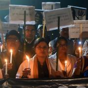 Women hold placards during a candle march seeking justice for rape-murder cases in 2019 in Patna, India. Picture: Parwaz Khan/Hindustan Times via Getty